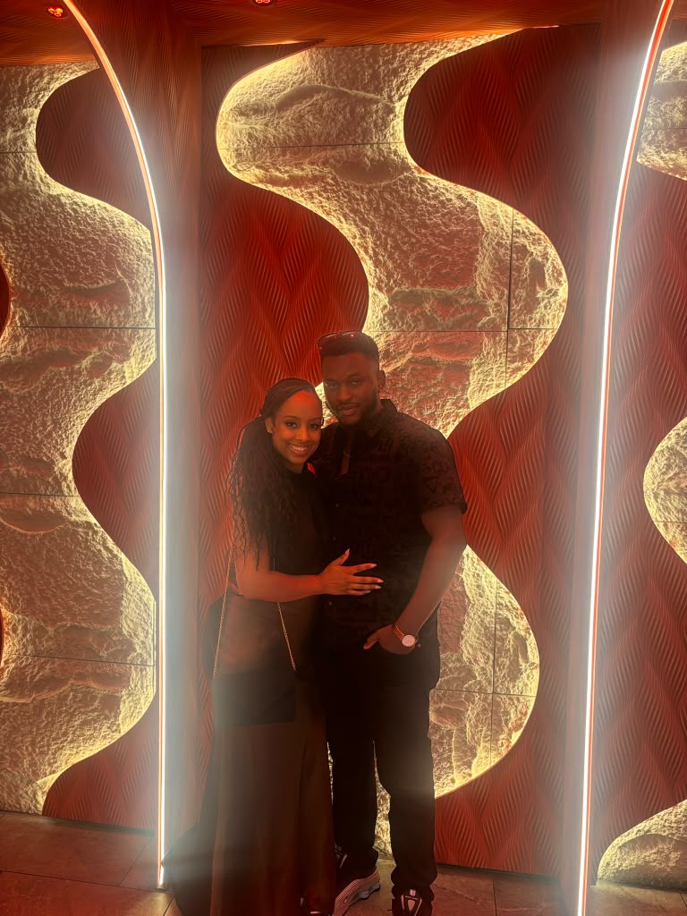 Akinyemi and Alexis together on an Atlanta rooftop